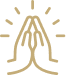 A silhouette of a person kneeling in prayer inside a small chapel with a cross on the wall behind them.